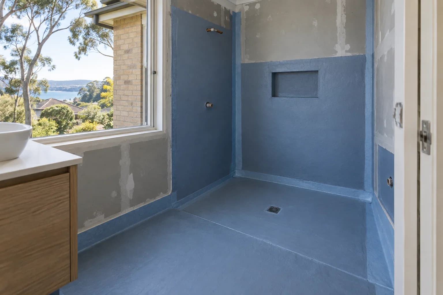 Illustrative wet-area waterproofing setting in Sydney